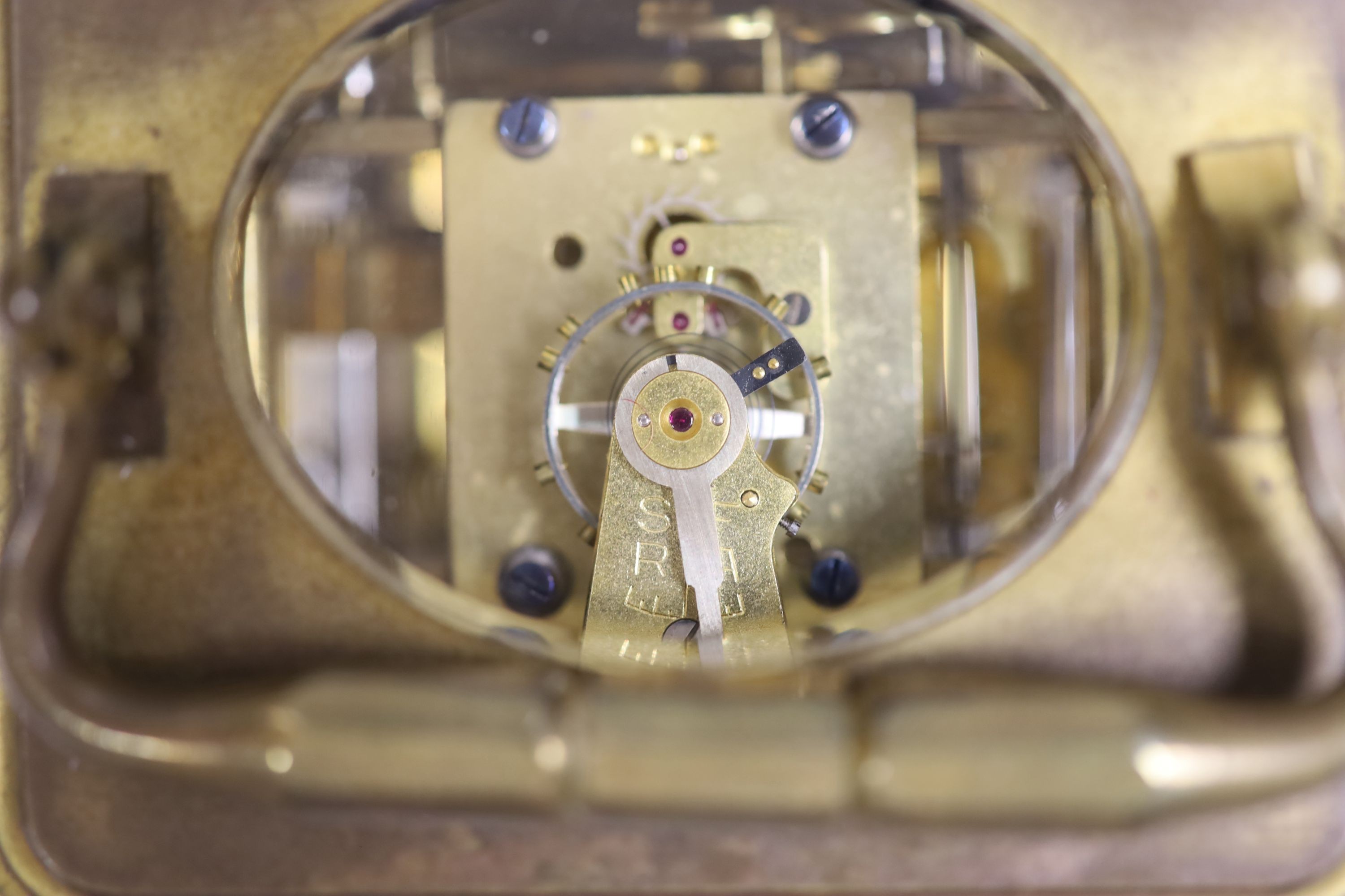 An early 20th century French brass carriage clock with alarm, 16cm high handle up, cased